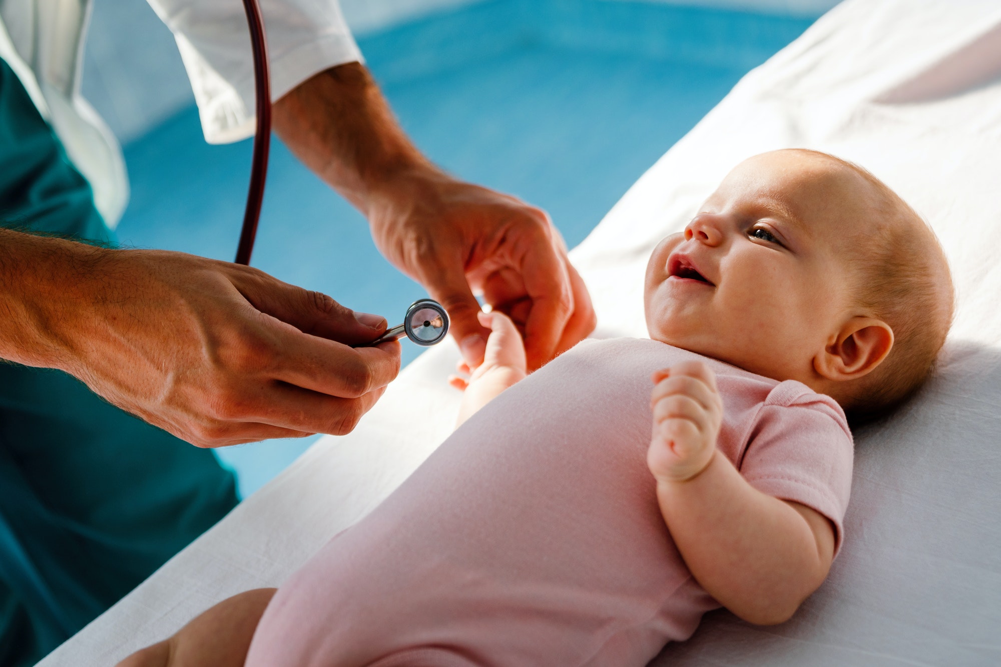 Pediatrician doctor examines baby. Healthcare, people, examination concept